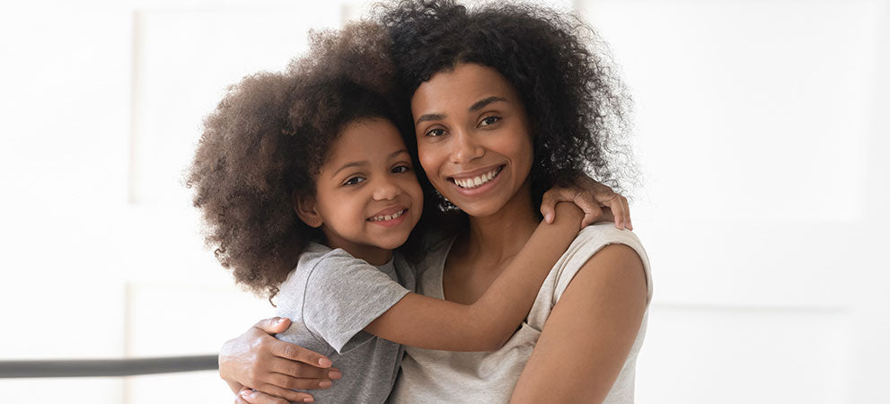 mother and daughter cuddling